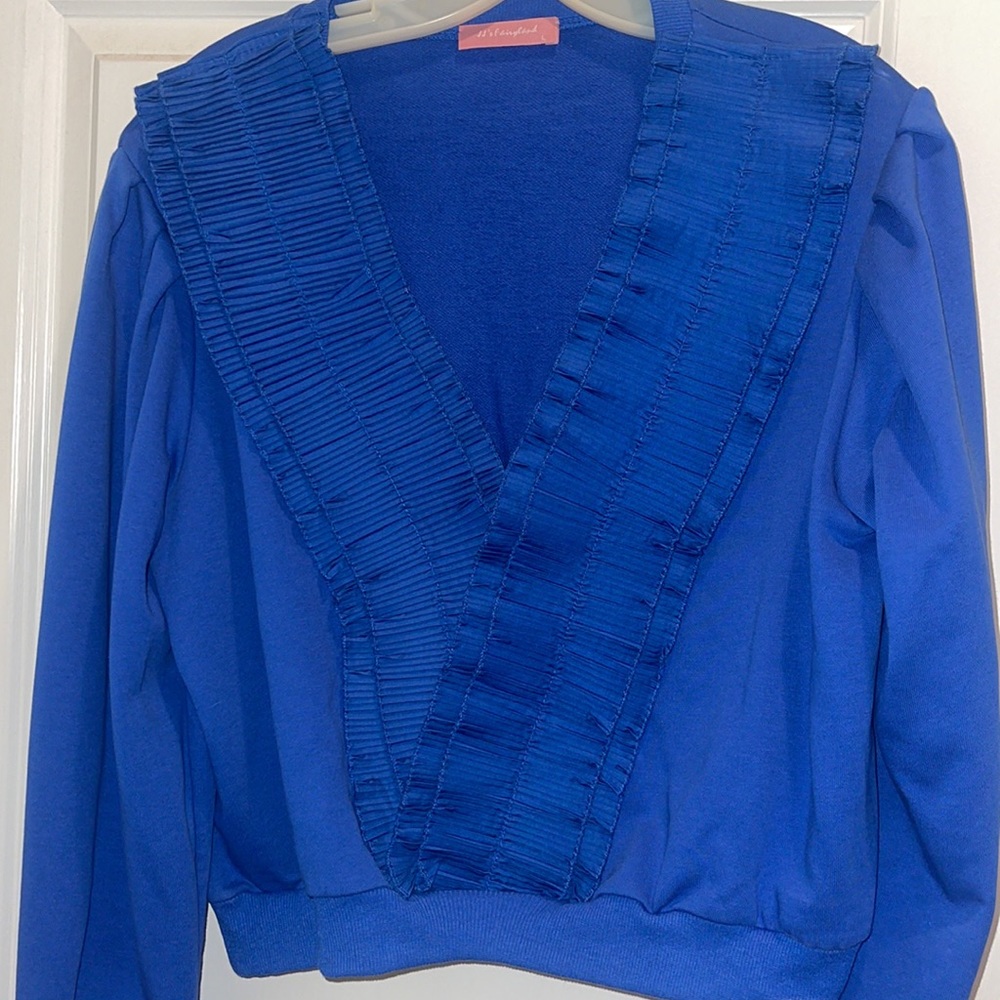 Alittle cropped royal blue pullover. Detailed smocked v-line
